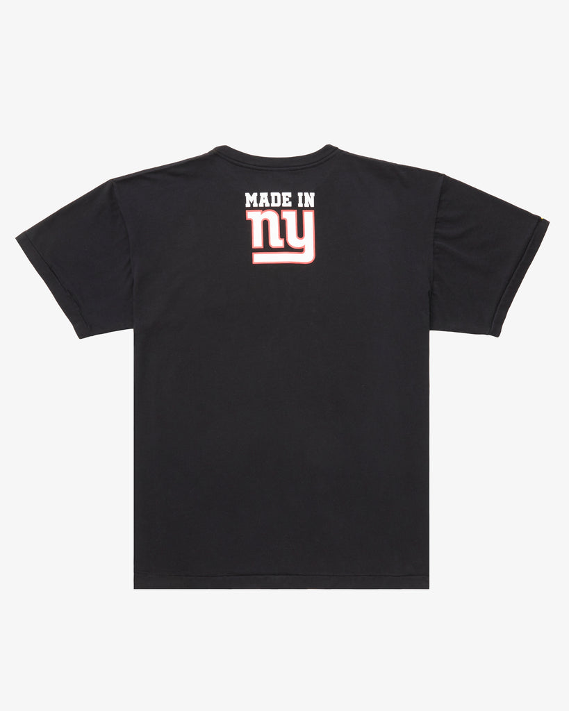 The rear of a Black Tee Shirt, featuring the text Made in NY using the OFFICIAL NFL GIANTS Jersey Font. 